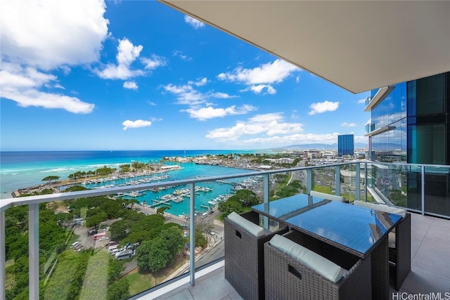 balcony featuring a water view