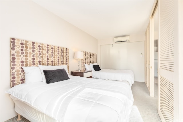 carpeted bedroom with an AC wall unit