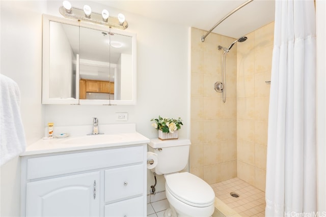 bathroom featuring toilet, walk in shower, vanity, and tile patterned flooring