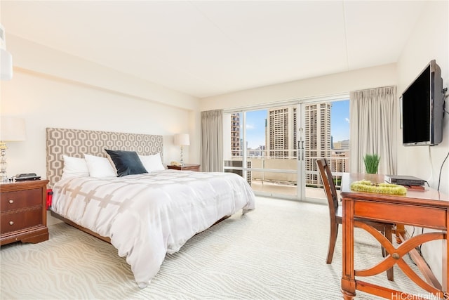 carpeted bedroom featuring access to outside