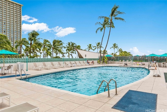 view of swimming pool with a patio