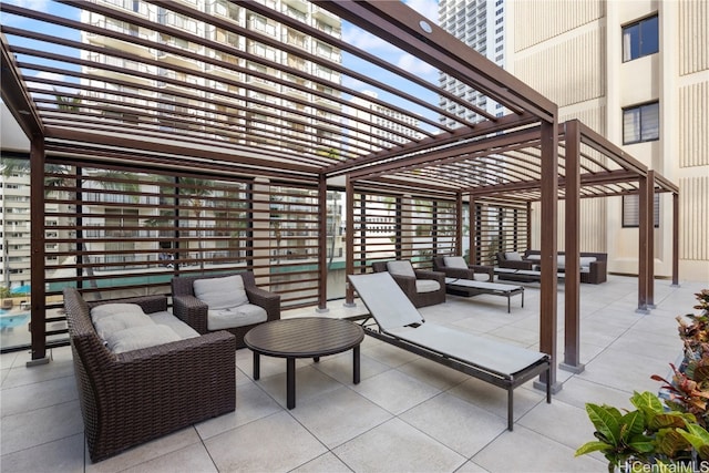 view of patio / terrace featuring a pergola and an outdoor hangout area