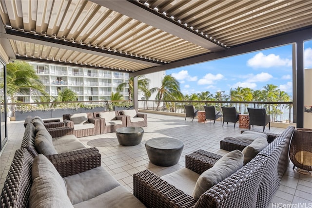 view of patio featuring an outdoor living space and a balcony