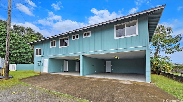 view of front of house with a garage and a front lawn