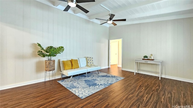 unfurnished room with beam ceiling, ceiling fan, wooden ceiling, wood walls, and dark wood-type flooring