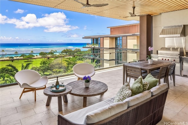 balcony with area for grilling, a water view, and ceiling fan