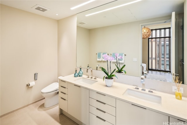 bathroom featuring toilet and vanity