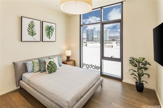 bedroom with hardwood / wood-style flooring