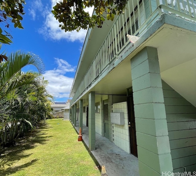 view of home's exterior with a yard