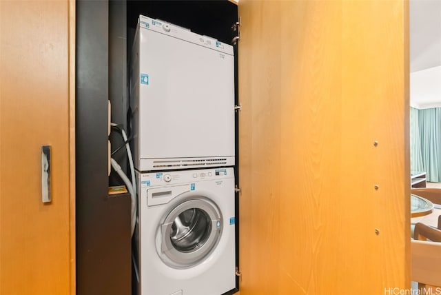 laundry area with stacked washer / drying machine