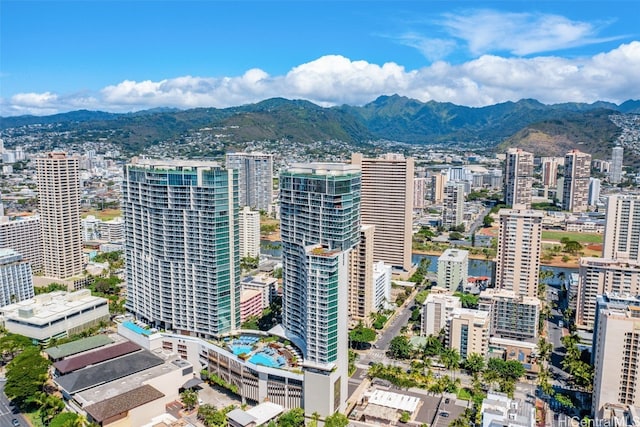 property's view of city with a mountain view