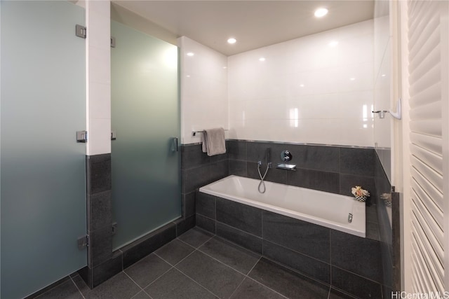 bathroom with tile patterned floors and plus walk in shower