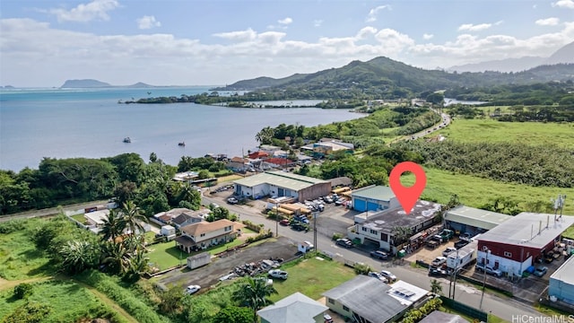 aerial view featuring a water and mountain view