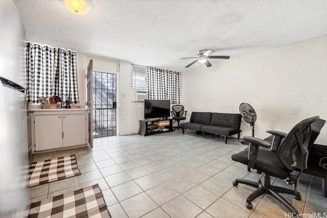 living room with a textured ceiling, light tile patterned flooring, and ceiling fan