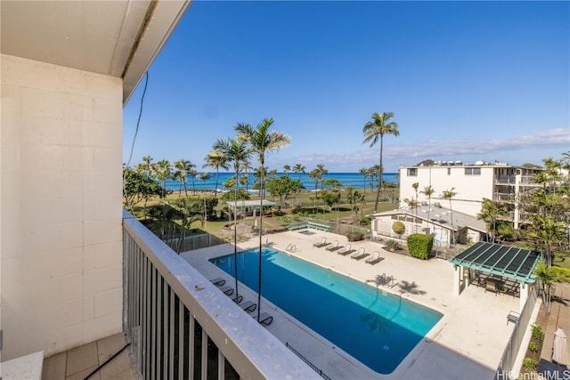 balcony featuring a patio area and a water view