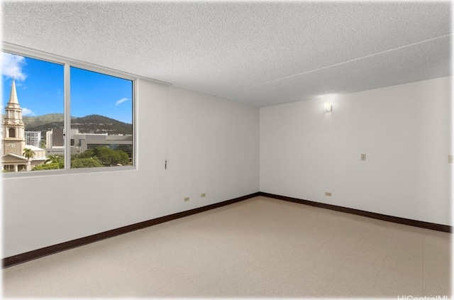 empty room with a textured ceiling