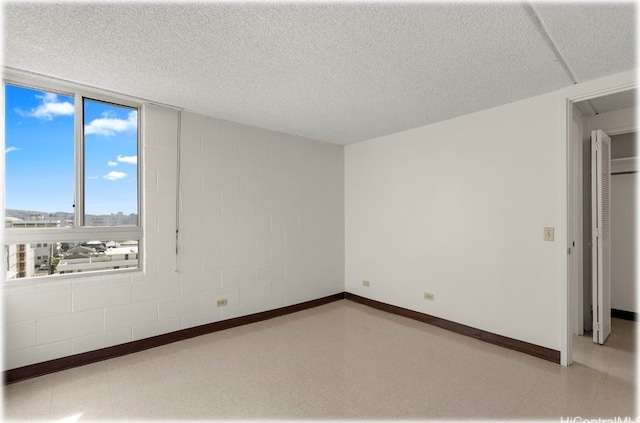 empty room with a textured ceiling