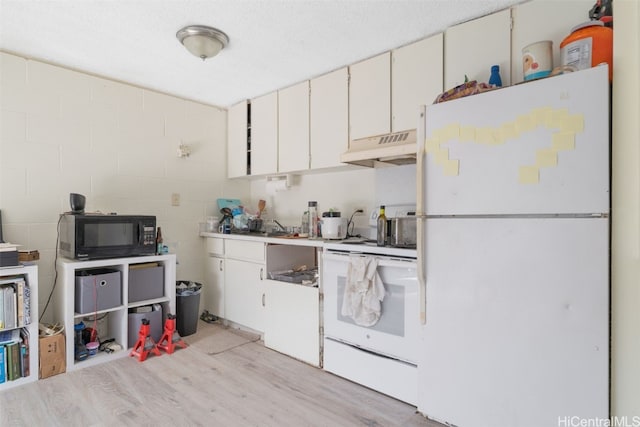 kitchen with white cabinetry, light wood-type flooring, a textured ceiling, and white appliances