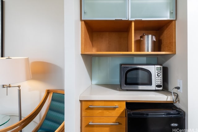 room details featuring black refrigerator