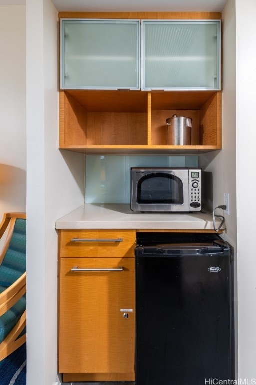 kitchen featuring black fridge