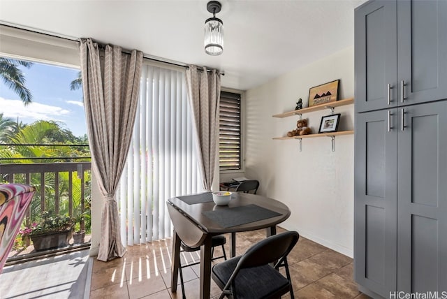 dining space with tile patterned floors