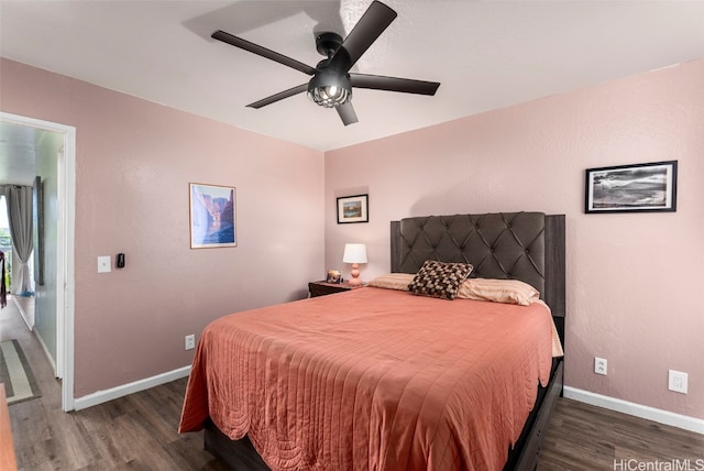 bedroom featuring dark hardwood / wood-style flooring and ceiling fan