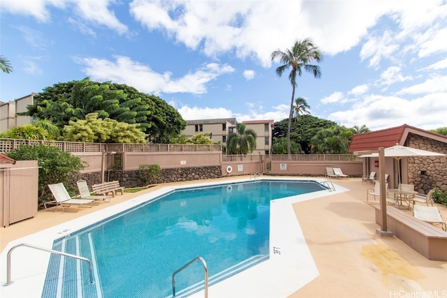 view of swimming pool featuring a patio area