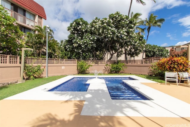 view of pool featuring a patio