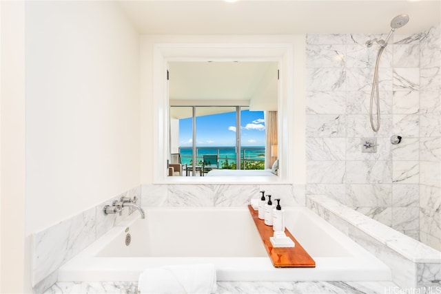 bathroom featuring separate shower and tub