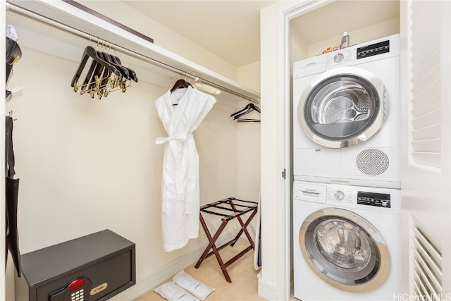 washroom with stacked washer and clothes dryer