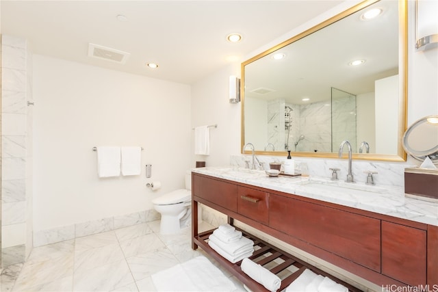 bathroom with vanity, walk in shower, and toilet