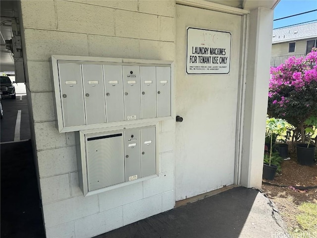 details featuring mail area and concrete block siding