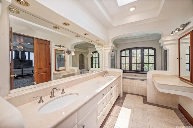 2999 Makalei Pl, Honolulu, HI 96815 - full bathroom with inlaid floor details, recessed lighting, a bath, a raised ceiling, and double vanity