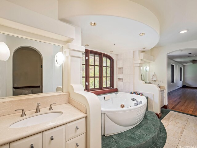 2999 Makalei Pl, Honolulu, HI 96815 - full bathroom with a whirlpool tub, recessed lighting, tile patterned floors, and vanity