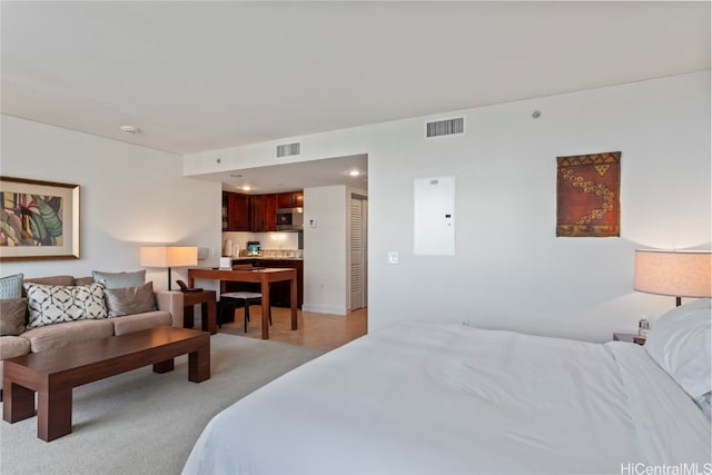 carpeted bedroom featuring a closet