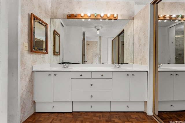 2877 Kalakaua Ave Unit 301, Honolulu, HI 96815 - full bath featuring a sink, a textured ceiling, and double vanity