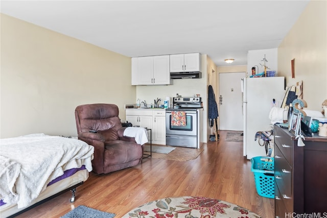 interior space with hardwood / wood-style floors and sink