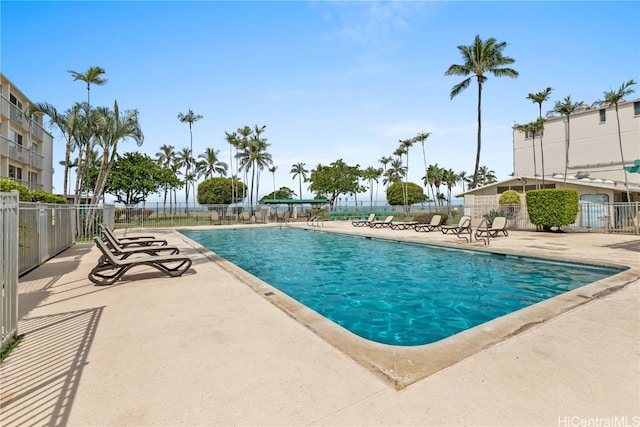 view of swimming pool with a patio