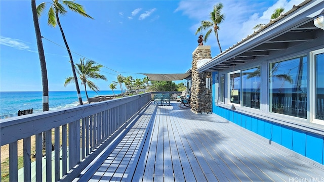 wooden terrace with a water view