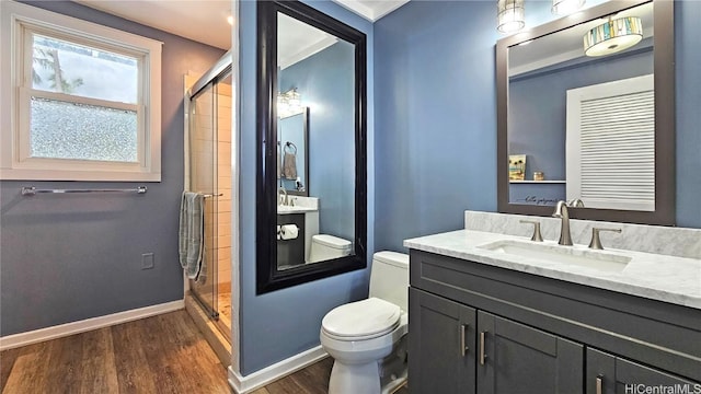 84-879 Moua St, Waianae, HI 96792 - bathroom with vanity, wood-type flooring, a shower with shower door, and toilet