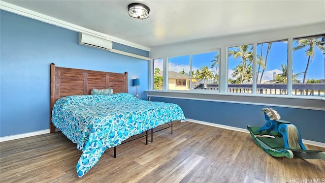 84-879 Moua St, Waianae, HI 96792 - bedroom featuring wood-type flooring and an AC wall unit