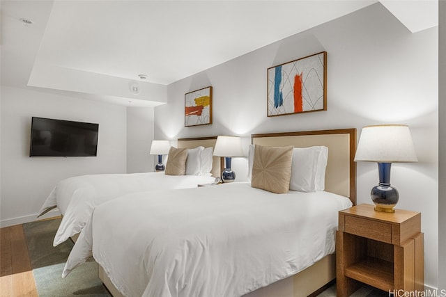 bedroom featuring dark hardwood / wood-style flooring