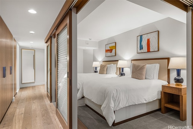 bedroom with light hardwood / wood-style flooring