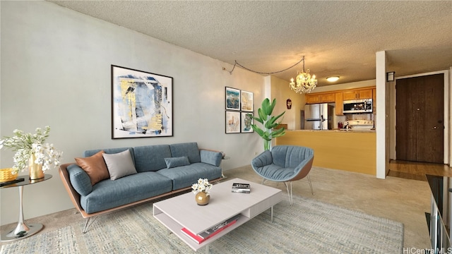 living room featuring a notable chandelier and a textured ceiling