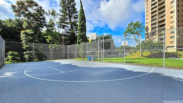 view of basketball court featuring a lawn