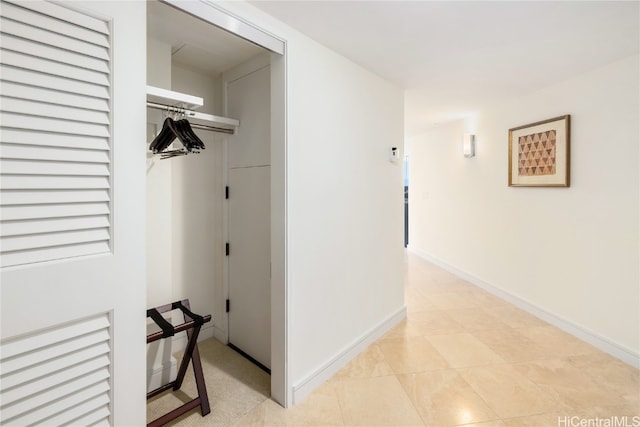 hallway featuring light tile patterned floors