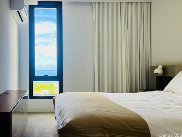 carpeted bedroom featuring a wall mounted AC