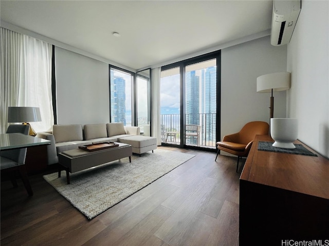 living room with a wall of windows and hardwood / wood-style flooring