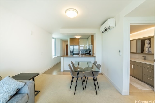 dining space with sink and a wall unit AC