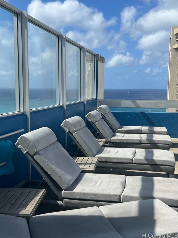 view of patio / terrace featuring a water view and a balcony